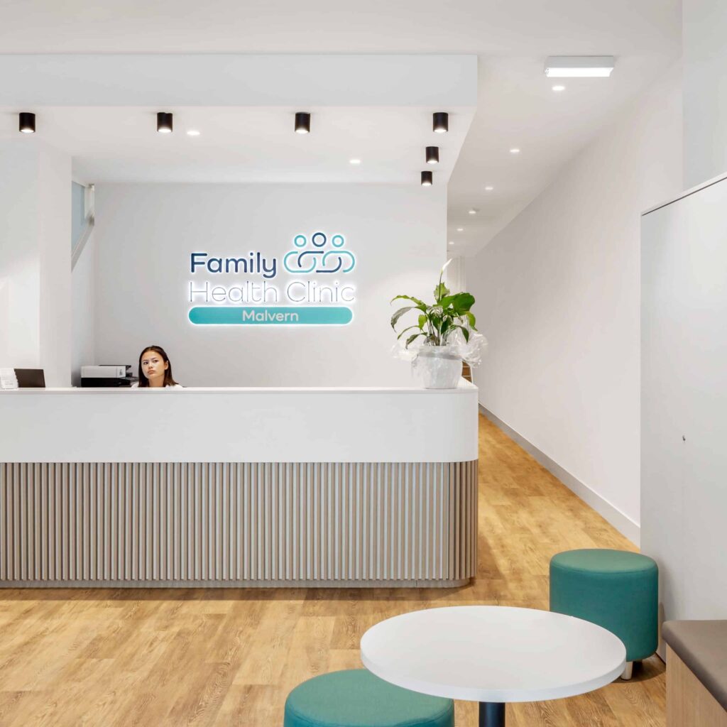 family health clinic reception- white walls and joinery with timber floors